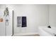 Bathroom featuring a walk-in shower, separate tub, and neutral decor at 228 Bergamot Loop, Davenport, FL 33837