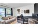 Bright bedroom with a large window, a comfortable couch, and workstation at 228 Bergamot Loop, Davenport, FL 33837