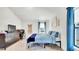 Bedroom with tile flooring, blue bedding, and natural light at 228 Bergamot Loop, Davenport, FL 33837