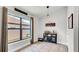 Bright dining area with large window, modern bar and tile flooring at 228 Bergamot Loop, Davenport, FL 33837