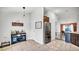 Bright dining area with modern bar, refrigerator, and tile flooring at 228 Bergamot Loop, Davenport, FL 33837
