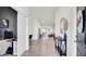 Spacious hallway with tile flooring leads into the home's living areas at 228 Bergamot Loop, Davenport, FL 33837