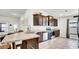 Well-appointed kitchen featuring stainless steel appliances and ample counter space for cooking at 228 Bergamot Loop, Davenport, FL 33837