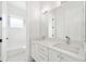 Elegant bathroom features double vanity with quartz countertop, subway tile, and modern fixtures at 2407 Lafayette Ave, Winter Park, FL 32789