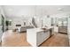 Spacious kitchen flows into the living area, featuring a large island, modern finishes, and natural light at 2407 Lafayette Ave, Winter Park, FL 32789