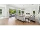 Bright living room with modern fireplace, patio access and stylish decor at 2407 Lafayette Ave, Winter Park, FL 32789
