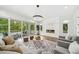 Bright living room with modern fireplace, patio access and stylish decor at 2407 Lafayette Ave, Winter Park, FL 32789