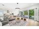 Bright living room featuring modern decor and patio access to pool area at 2407 Lafayette Ave, Winter Park, FL 32789