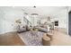 Open concept living room with access to kitchen and staircase at 2407 Lafayette Ave, Winter Park, FL 32789