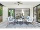 Charming covered patio with views of the open-concept interior living spaces at 2407 Lafayette Ave, Winter Park, FL 32789