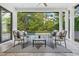 Covered patio featuring an outdoor lounge area with views of the backyard and pool at 2407 Lafayette Ave, Winter Park, FL 32789