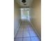 Hallway featuring neutral paint colors and tile flooring at 2414 E Orange Ave, Eustis, FL 32726