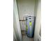 Water heater closet with tile flooring in home at 2414 E Orange Ave, Eustis, FL 32726