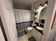 Bathroom featuring black and white accents, a vanity with a mirror, and a shower with a curtain at 243 Country Landing Blvd, Apopka, FL 32703