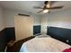 Bedroom features a large closet, plush bedding, and a ceiling fan for added comfort at 243 Country Landing Blvd, Apopka, FL 32703