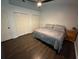Bedroom features wood floors, ceiling fan and closet at 243 Country Landing Blvd, Apopka, FL 32703
