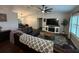 Bright living room with hardwood floors, a leather couch, and a decorative fireplace at 243 Country Landing Blvd, Apopka, FL 32703