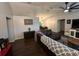 Spacious living room featuring hardwood floors, a leather couch, and open access to the dining room at 243 Country Landing Blvd, Apopka, FL 32703