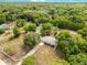 Aerial view of a home surrounded by lush greenery and trees at 2550 Barren Oak Ct, Deland, FL 32720