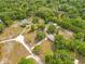 Aerial view of a home nestled among lush trees, offering privacy and natural beauty at 2550 Barren Oak Ct, Deland, FL 32720