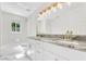 Elegant bathroom with double vanity, granite countertop, and luxurious finishes at 2550 Barren Oak Ct, Deland, FL 32720