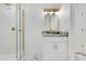 Bright bathroom with white marble floors, modern gold shower and vanity hardware at 2550 Barren Oak Ct, Deland, FL 32720