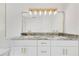 Modern bathroom with double sink vanity, granite counters, and stylish gold lighting at 2550 Barren Oak Ct, Deland, FL 32720