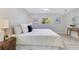 Bedroom featuring a large bed, wood floors, and natural light from a large window at 2550 Barren Oak Ct, Deland, FL 32720