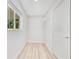 Walk-in closet with white walls, wood floors, and ample shelving at 2550 Barren Oak Ct, Deland, FL 32720
