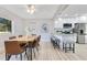 Bright dining room with an adjacent kitchen featuring a breakfast bar and stainless steel appliances at 2550 Barren Oak Ct, Deland, FL 32720