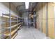 Interior view of a garage or storage shed with metal shelving and ample storage space at 2550 Barren Oak Ct, Deland, FL 32720