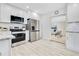 Open kitchen design with stainless steel appliances and easy access to living area at 2550 Barren Oak Ct, Deland, FL 32720