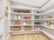 Spacious walk-in pantry with custom shelving, providing ample storage for all your needs at 2550 Barren Oak Ct, Deland, FL 32720