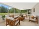 Bright sunroom with modern furnishings and views of the beautiful lawn at 2550 Barren Oak Ct, Deland, FL 32720