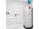 Utility room featuring a modern, newly installed water heater at 2550 Barren Oak Ct, Deland, FL 32720