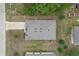 Aerial view of the house, highlighting its roof and lot in a residential area at 269 Fig Ct, Kissimmee, FL 34759