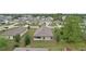 An aerial view of the home's backyard, patio, and surrounding neighborhood in a suburban setting at 269 Fig Ct, Kissimmee, FL 34759