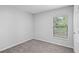 Bedroom with carpet flooring and a window at 269 Fig Ct, Kissimmee, FL 34759