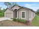 Attractive home exterior with landscaping, showcasing a well-manicured front yard at 269 Fig Ct, Kissimmee, FL 34759