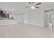 Open-concept living space showcasing tile floors, recessed lighting and seamless flow into the kitchen at 269 Fig Ct, Kissimmee, FL 34759