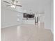 Open-concept living space featuring tile floors and views of the modern kitchen at 269 Fig Ct, Kissimmee, FL 34759