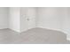 Bright, tiled room with a white door, perfect for any living space at 269 Fig Ct, Kissimmee, FL 34759