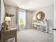 Bright bedroom designed with a coastal vibe, featuring neutral colors and a work space at 2710 Golden Trout Ln, Edgewater, FL 32141