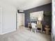 Cozy bedroom featuring a desk, chair, and stylish wall art, creating an inviting space at 2710 Golden Trout Ln, Edgewater, FL 32141