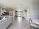 Spacious foyer with tile flooring, multiple entry points, and view into the kitchen and living area at 2710 Golden Trout Ln, Edgewater, FL 32141