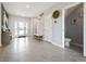 Bright foyer with tile flooring, white walls, and staircase leading to the upper level at 2710 Golden Trout Ln, Edgewater, FL 32141
