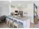 Modern kitchen with granite countertops, island seating, and stainless steel appliances at 2710 Golden Trout Ln, Edgewater, FL 32141