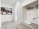 Well-lit laundry room with washer hookups, storage shelves, and neutral color scheme at 2710 Golden Trout Ln, Edgewater, FL 32141