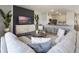 Comfortable living room with plush seating, entertainment center, and adjacent breakfast bar at 2710 Golden Trout Ln, Edgewater, FL 32141
