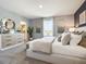 Elegant main bedroom featuring a dresser, large mirror, and a comfortable bed with decorative pillows at 2710 Golden Trout Ln, Edgewater, FL 32141